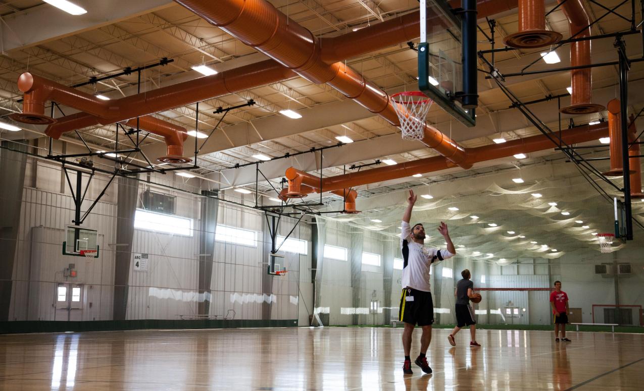 Wood-floored basketball court at the Adventure Recreation Center